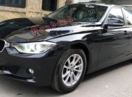 BMW 3 Series 320i 2012 - Cần bán xe BMW 320i sản xuất 2012, model 2013 màu đen giá 720 triệu tại Hà Nội