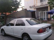 Mazda 323 1999 - Cần bán gấp Mazda 323 sản xuất năm 1999, màu trắng, nhập khẩu giá 90 triệu tại Vĩnh Long