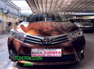 Toyota Corolla   2016 - Cần bán Toyota Corolla sản xuất 2016, màu nâu như mới giá 630 triệu tại Hà Nội