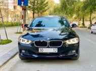 BMW 3 Series 320i 2014 - Bán xe BMW 3 Series 320i sản xuất năm 2014, màu đen, xe nhập, 850 triệu giá 850 triệu tại Hà Nội