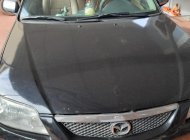 Mazda 323 2003 - Bán Mazda 323 đời 2003, màu đen chính chủ, giá tốt giá 150 triệu tại Quảng Bình