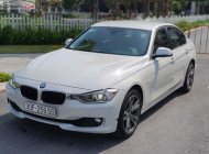 BMW 3 Series 320i  2013 - Cần bán gấp BMW 3 Series 320i năm sản xuất 2013, màu trắng, nhập khẩu nguyên chiếc chính chủ, giá tốt giá 815 triệu tại Hà Nội
