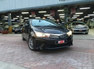 Cần bán lại xe Toyota Corolla altis 1.8G MT đời 2014, màu đen giá 530 triệu tại Tp.HCM