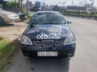 Daewoo Lacetti 2005 - Bán ô tô Daewoo Lacetti sản xuất 2005, màu đen còn mới, 110 triệu giá 110 triệu tại Tiền Giang