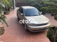 Ford Laser    2002 - Cần bán gấp Ford Laser 2002, màu vàng giá 115 triệu tại Vĩnh Phúc