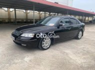 Ford Mondeo    2003 - Bán xe Ford Mondeo năm sản xuất 2003, màu đen còn mới, giá tốt giá 100 triệu tại Thanh Hóa