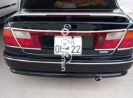 Mazda 323 1999 - Cần bán lại xe Mazda 323 năm 1999, màu đen, xe nhập, 130 triệu giá 130 triệu tại Kiên Giang