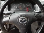 Cần bán Mazda 323 sản xuất 2004, màu đen, giá tốt giá 122 triệu tại Tiền Giang