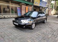 Kia Spectra MT 2004 - Cần bán Kia Spectra MT đời 2004, màu đen, giá chỉ 87 triệu giá 87 triệu tại Hà Tĩnh