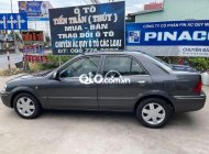 Ford Laser 2002 - Cần bán Ford Laser năm sản xuất 2002, màu xám giá 125 triệu tại Tiền Giang