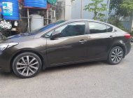 Kia K3 2014 - Cần bán lại xe Kia K3 2.0 AT sản xuất năm 2014, màu nâu giá 420 triệu tại Nam Định