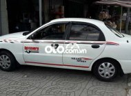 Daewoo Lanos 2003 - Cần bán gấp Daewoo Lanos MT sản xuất năm 2003, màu trắng, nhập khẩu giá 57 triệu tại Sóc Trăng