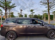 Cần bán xe Kia Sedona 3.3 GATH sản xuất 2015, màu nâu, nhập khẩu nguyên chiếc xe gia đình giá 680 triệu tại Bình Dương