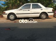 Mazda 323  MT 1996 - Bán Mazda 323 MT năm sản xuất 1996, màu trắng số sàn, giá tốt giá 59 triệu tại Tp.HCM