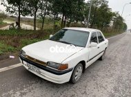 Mazda 323 1994 - Xe Mazda 323 2.0MT sản xuất năm 1994, màu trắng, xe nhập giá 25 triệu tại Hà Nội