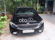 Kia Cerato 2017 - Bán Kia Cerato 1.6MT năm sản xuất 2017, màu đen xe gia đình  giá 400 triệu tại Tiền Giang