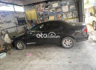 Mazda 323 1999 - Màu đen giá 87 triệu tại Bình Định