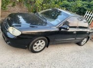 Kia Spectra 2004 - Màu đen giá 86 triệu tại Bến Tre