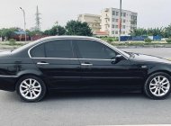 BMW 318i   2004 - Bán ô tô BMW 318i sản xuất 2004, màu đen giá 140 triệu tại Hải Phòng