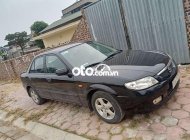 Mazda 323 Bán xe   màu đen, sx 2002. 2002 - Bán xe Mazda 323 màu đen, sx 2002. giá 93 triệu tại Hải Dương