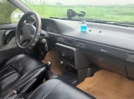 Mazda 323 1995 - Cần bán xe màu trắng giá 75 triệu tại Thanh Hóa