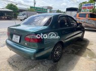 Daewoo Lanos cần bán  nhập số tự động ngay chủ 2002 - cần bán lanos nhập số tự động ngay chủ giá 95 triệu tại Vĩnh Long