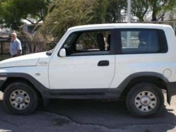 Ssangyong Korando     MT 2002 - Bán ô tô Ssangyong Korando MT đời 2002, màu trắng 