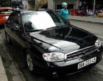 Kia Spectra   MT 1995 - Bán Kia Spectra MT đời 1995, màu đen số sàn