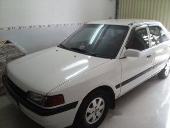 Mazda 323 MT 1995 - Cần bán gấp Mazda 323 1995, màu trắng số sàn, giá chỉ 90 triệu