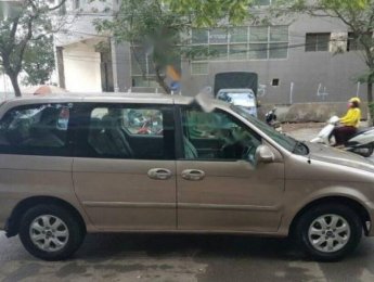 Kia Carnival 2009 - Cần bán xe Kia Carnival đời 2009, màu vàng số tự động, 340tr