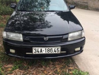 Mazda 323 MT 2000 - Bán Mazda 323 MT đời 2000, màu đen, xe nhập số sàn, 115 triệu
