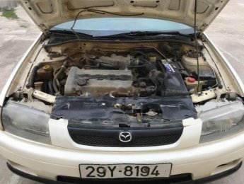 Mazda 323 MT 2000 - Bán xe Mazda 323 MT năm sản xuất 2000, màu trắng
