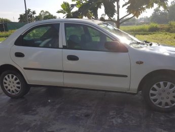 Mazda 323 2000 - Bán xe Mazda 323 đời 2000, màu trắng nhập khẩu, giá chỉ 85 triệu