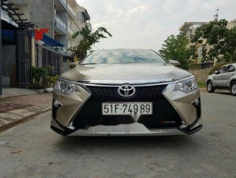 Toyota Camry 2016 - Bán Toyota Camry 2016, màu vàng cát