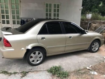 Ford Laser   2003 - Cần bán lại xe Ford Laser đời 2003, màu vàng xe gia đình, giá chỉ 180 triệu