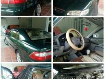 Mazda 626   2003 - Cần bán lại xe Mazda 626 năm sản xuất 2003, màu xanh lục chính chủ, giá chỉ 165 triệu