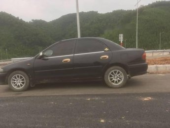 Mazda 323   2001 - Cần bán gấp Mazda 323 sản xuất năm 2001, màu đen, 105 triệu