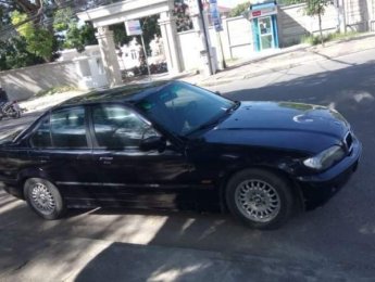 BMW 3 Series 320i 1997 - Cần bán BMW 320i 1997, màu đen, xe nhập