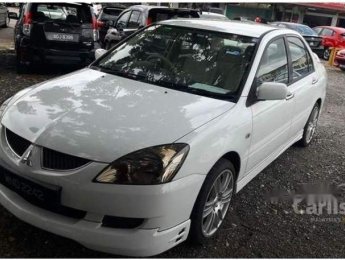 Mitsubishi Lancer  1.6MT   2005 - Bán xe Mitsubishi Lancer 1.6MT 2005, màu trắng, gia đình đi được bảo dưỡng cẩn thận