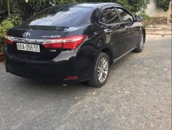 Toyota Corolla altis  MT 2017 - Cần bán gấp Toyota Corolla Altis MT đời 2017, màu đen, xe gia đình sử dụng kĩ nên còn rất đẹp
