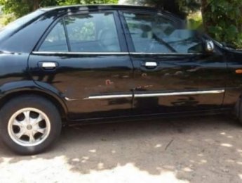 Mazda 323   Classic GLX   2004 - Cần bán Mazda 323 Classic GLX năm sản xuất 2004, màu đen chính chủ, 199 triệu