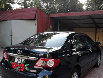 Toyota Corolla altis G 2014 - Bán xe Toyota Corolla Altis G sản xuất năm 2014, màu đen chính chủ, giá 635tr