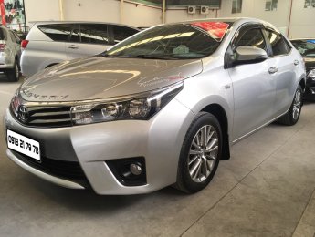 Toyota Corolla altis 1.8G 2015 - Bán ô tô Toyota Corolla altis 1.8G đời 2015, màu bạc, giá tốt