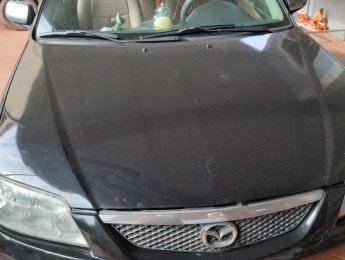 Mazda 323 2003 - Bán Mazda 323 đời 2003, màu đen chính chủ, giá tốt