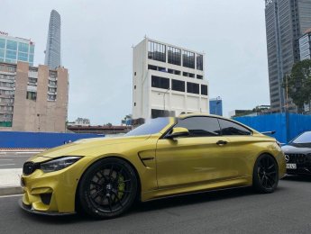 BMW M4   2017 - Bán ô tô BMW M4 đời 2017, màu vàng, xe nhập còn mới