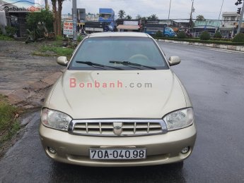 Kia Spectra   1.6 MT  2004 - Xe Kia Spectra 1.6 MT sản xuất năm 2004, màu vàng còn mới, 90 triệu