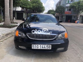 Daewoo Magnus AT 2004 - Cần bán xe Daewoo Magnus AT sản xuất năm 2004, màu đen, xe nhập