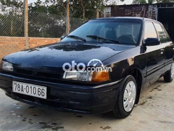 Mazda 323 MT 1994 - Cần bán xe Mazda 323 MT năm sản xuất 1994, màu đen, xe nhập, giá chỉ 39 triệu