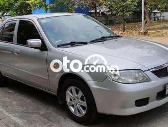 Mazda 323  MT 2002 - Cần bán xe Mazda 323 MT sản xuất 2002, màu bạc, nhập khẩu nguyên chiếc chính chủ