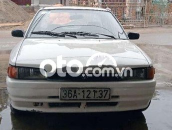 Mazda 323 1996 - Cần bán lại xe Mazda 323 2.0MT sản xuất 1996, màu trắng, xe nhập